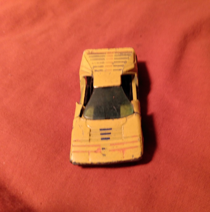 YELLOW HOT WHEELS CARABO WITH DOORS BROKEN OFF