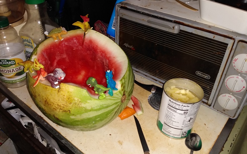 DINO FROZ DINOSAURS EATING PINEAPPLE FROM A CAN