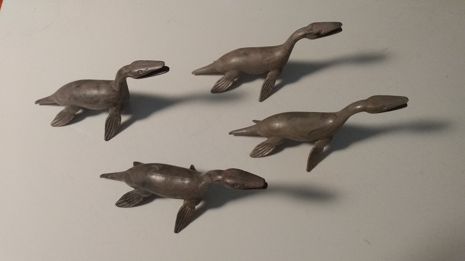 FOUR MARBLED MARX KRONOSAURS