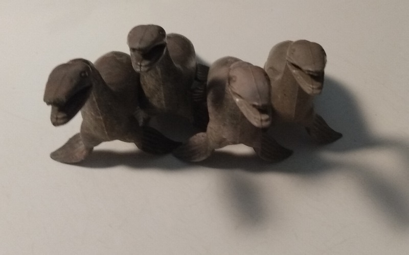 FOUR MARBLED MARX KRONOSAURS