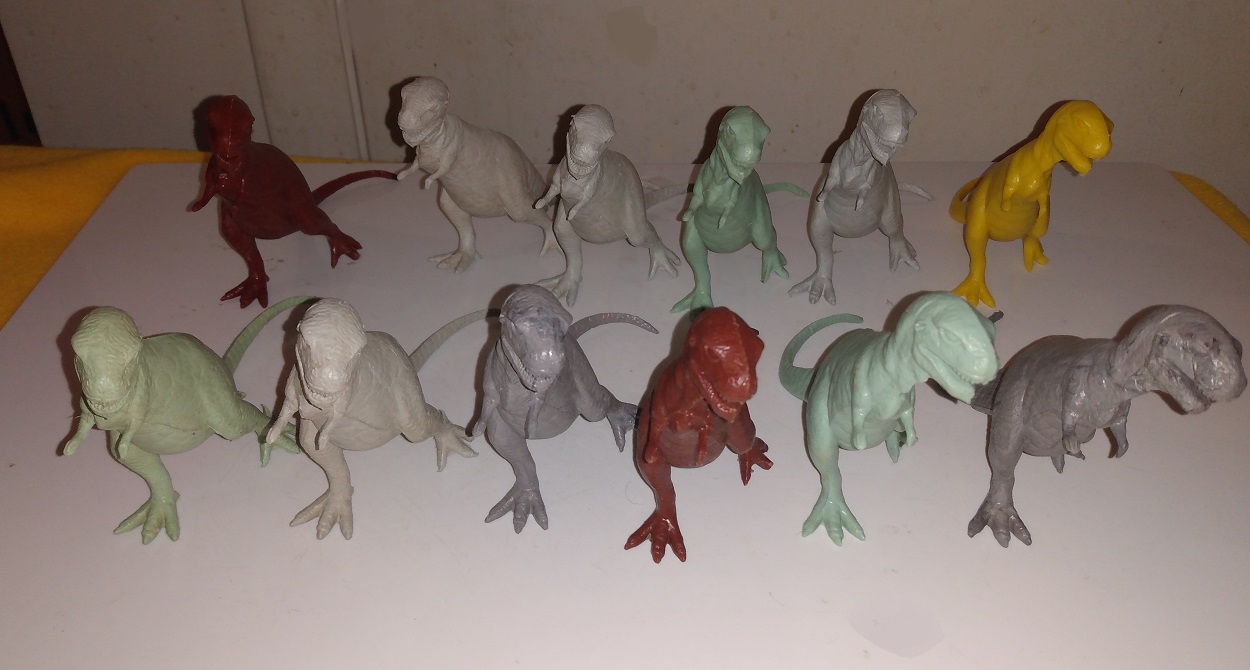 DOZEN MARX TYPE TWO TYRANNOSAURS REX