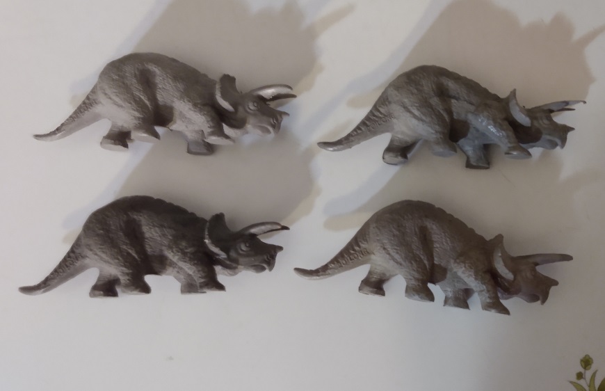 FOUR DIFFERENT GRAY TRICERATOPS