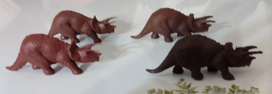 FOUR BROWN TRICERATOPS