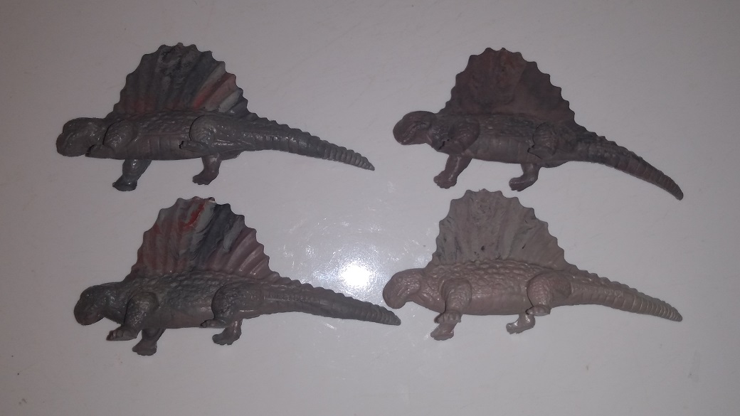 FOUR MARBLED MARX DIMETRODONS