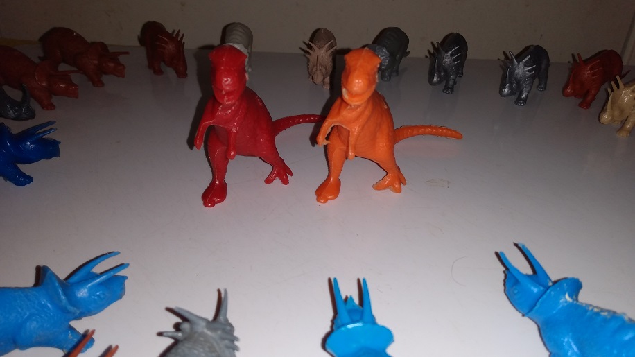 THE TO MPC TYRANNOSAURUS ARE SURROUNDED BY ANGRY CERTOPSINS