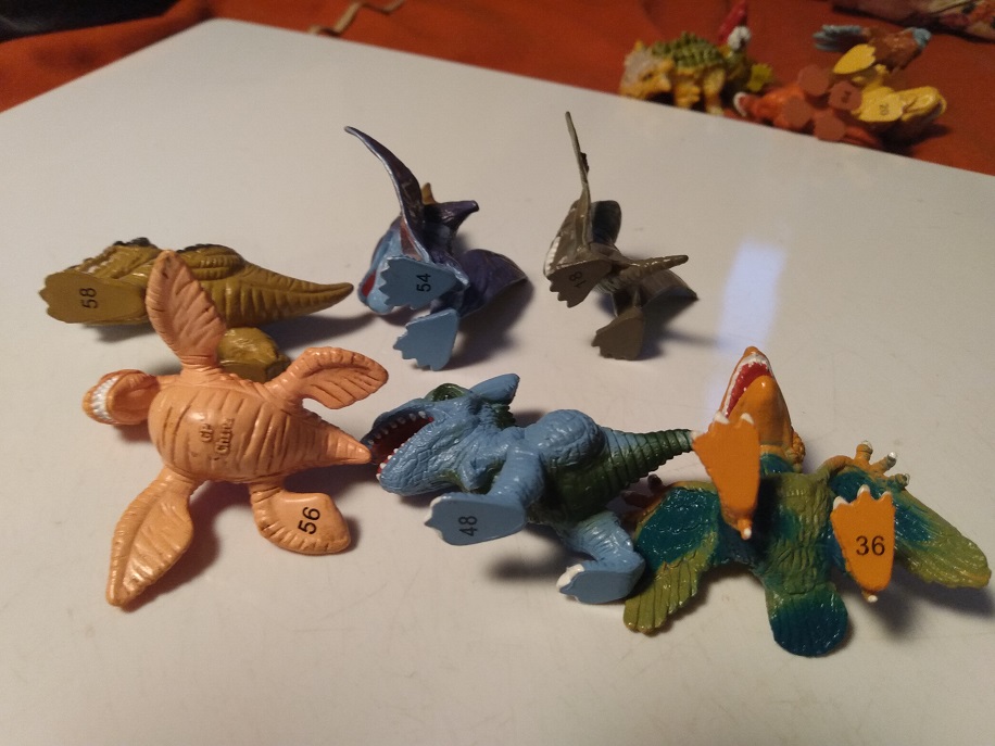 UNDERSIDE NUMBERING OF SEVERAL DINO FROZ FIGURES