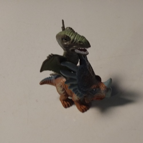 ANOTHER FLYING DINOSAUR RIDING A STYRACOSAURUS