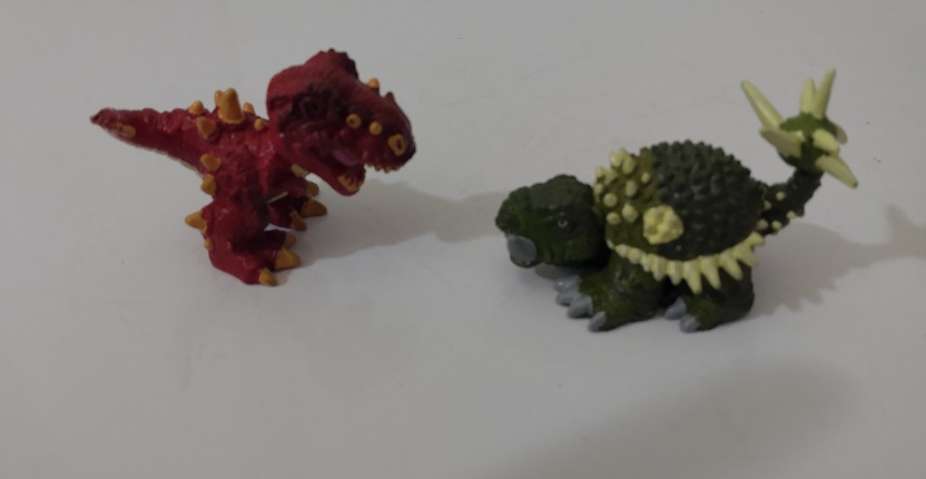 TWO DINO FROZ DINOSAURS