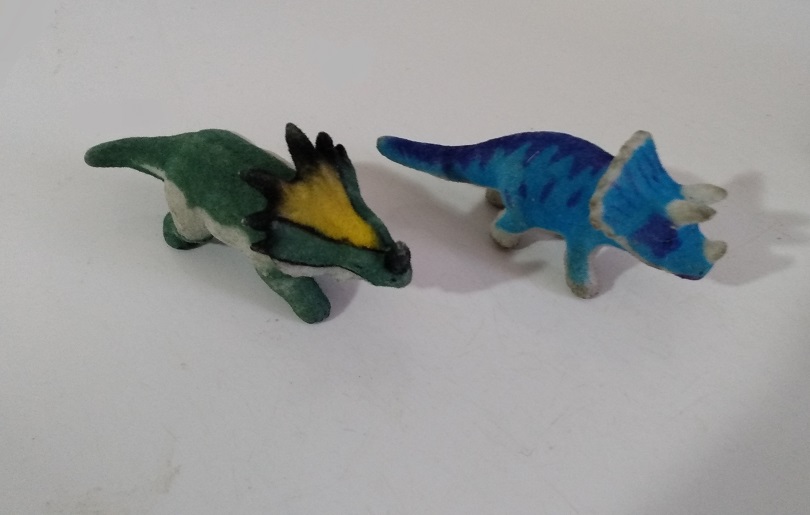 TWO FLOCKED DINOSAURS