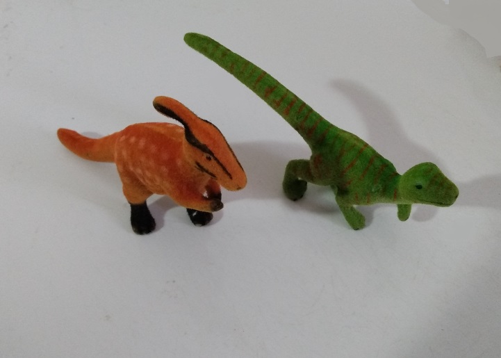 TWO FLOCKED DINOSAURS