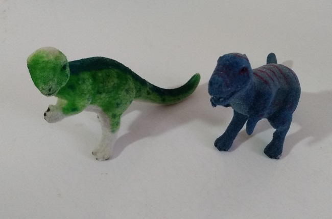 TWO FLOCKED DINOSAURS