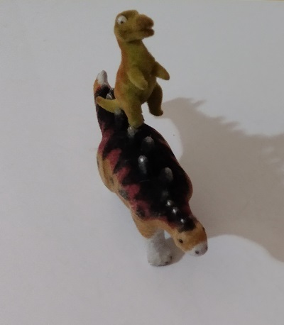 ACROBATICALLY RIDING A STEGOSAURUS