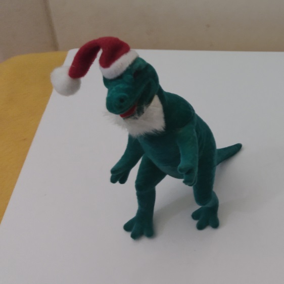 FLOCKED TYRANNOSAURUS SANTA