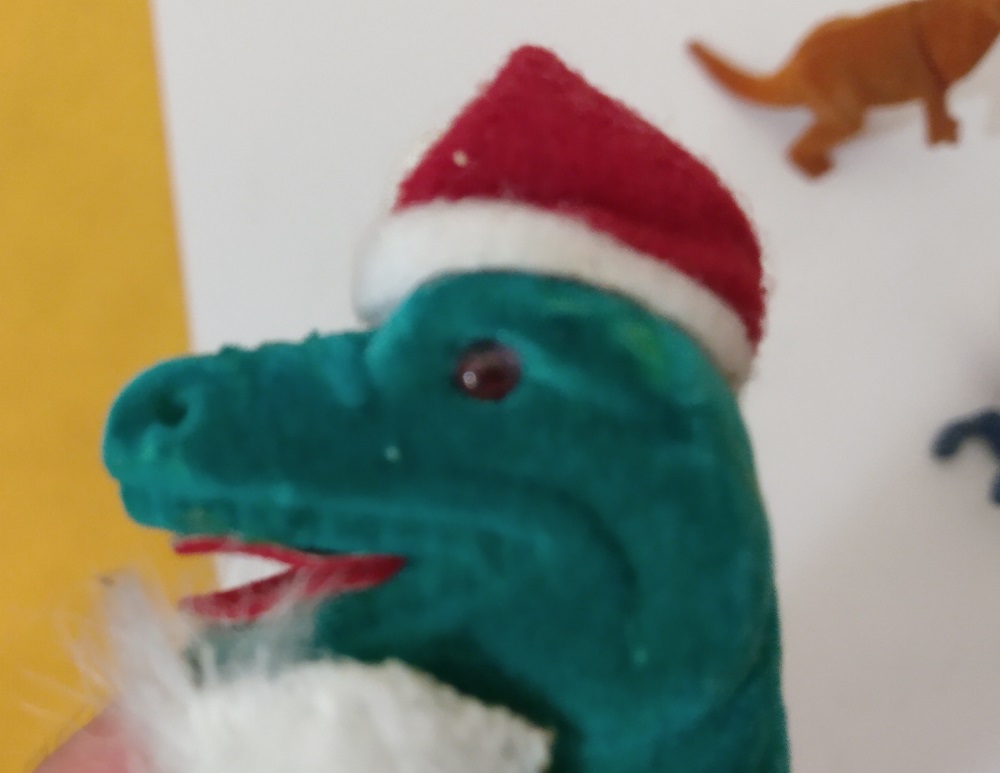 FLOCKED TYRANNOSAURUS SANTA