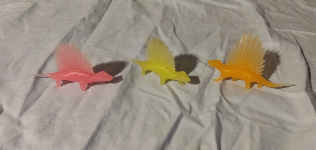 THREE TRANSLUCENT DIMETRODONS IN DIFFERENT COLORS