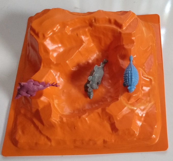 THREE DINOSAURS IN THE MOUNTAINS