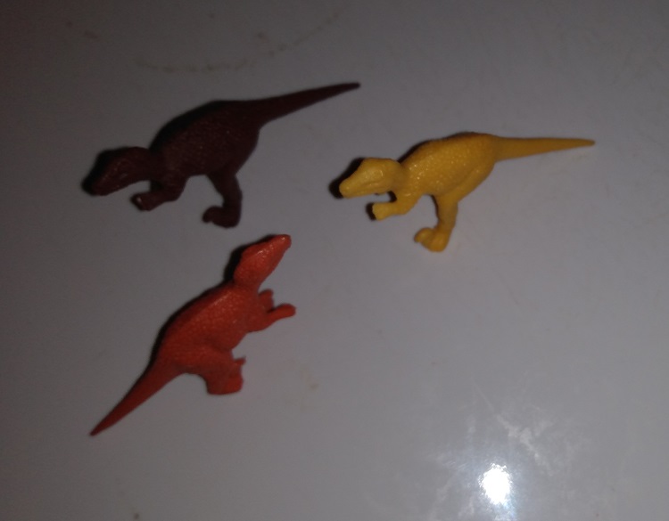 THREE DINOSAUR FIGURES
