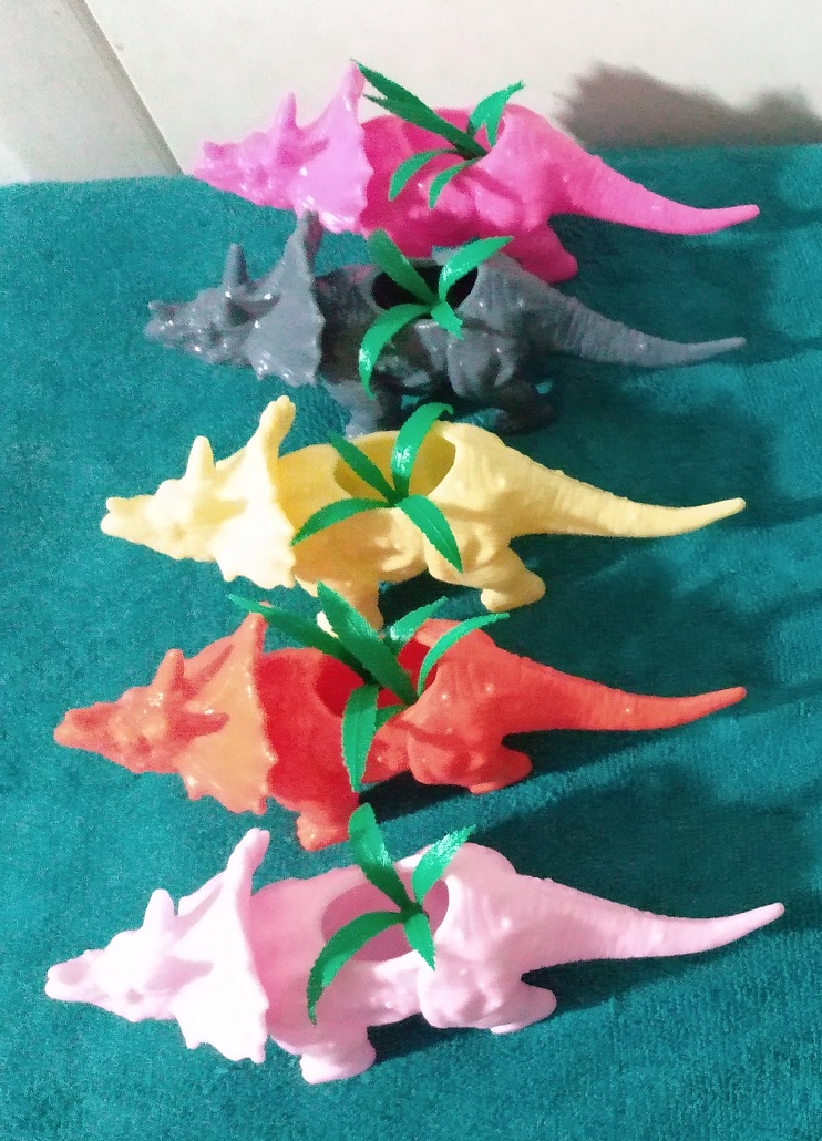 TRICERATOPS PLANTERS WITH PLASTIC PLANTS