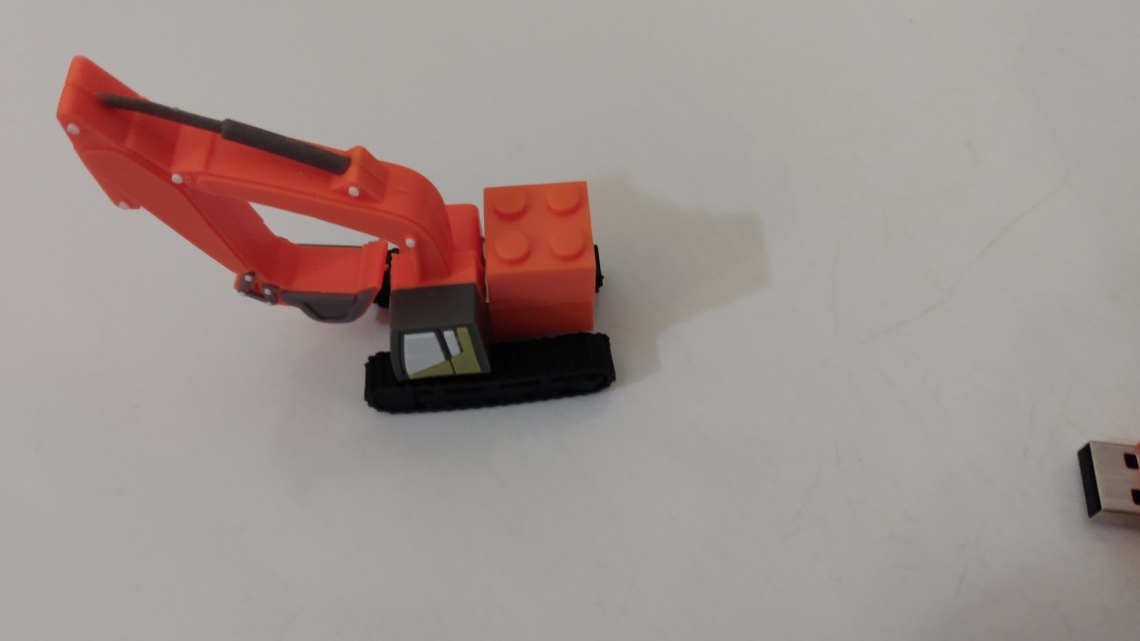 ORANGE CRANE WITH BRICK ATTATCHED